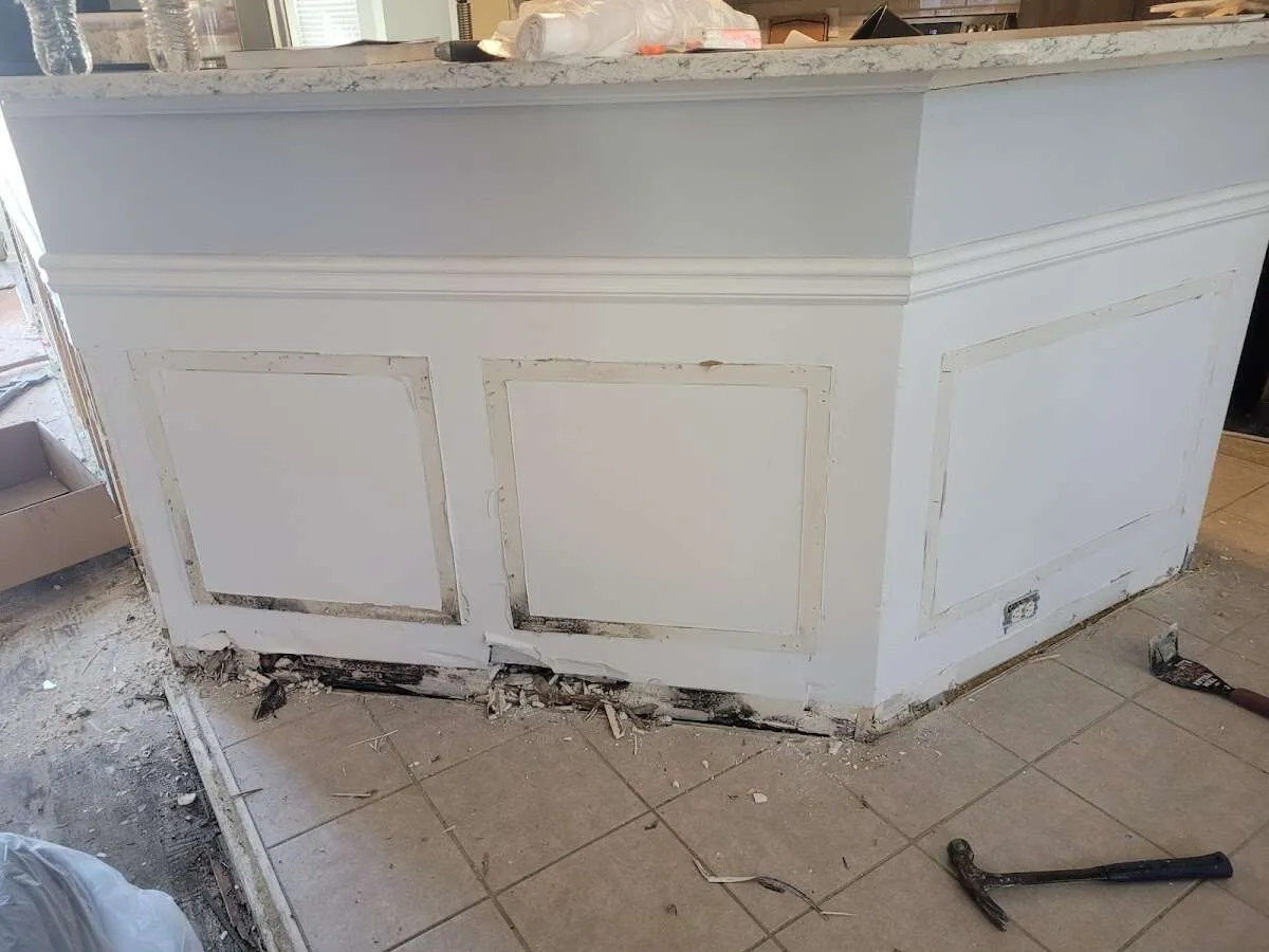 Water damage and mold on kitchen during Sewage Cleanup & Sanitation in Beverly